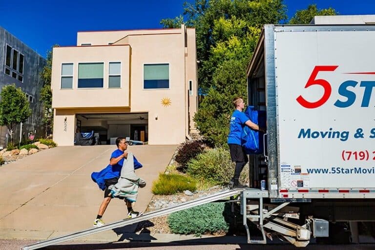 5 Star Moving truck parked at a home on moving day in Colorado Springs - 5 Star Moving & Storage 5 Star Moving truck parked at a home on moving day in Colorado Springs