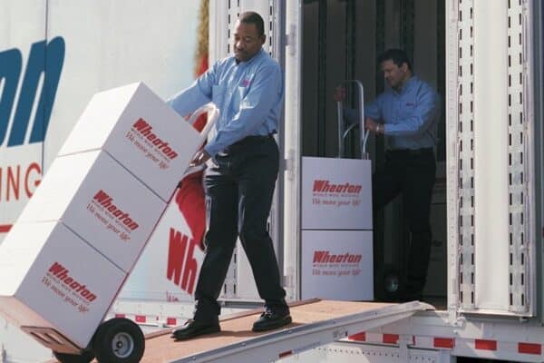 Movers loading boxes onto a Wheaton moving truck in Colorado Springs - 5 Star Moving & Storage Movers loading boxes onto a Wheaton moving truck in Colorado Springs