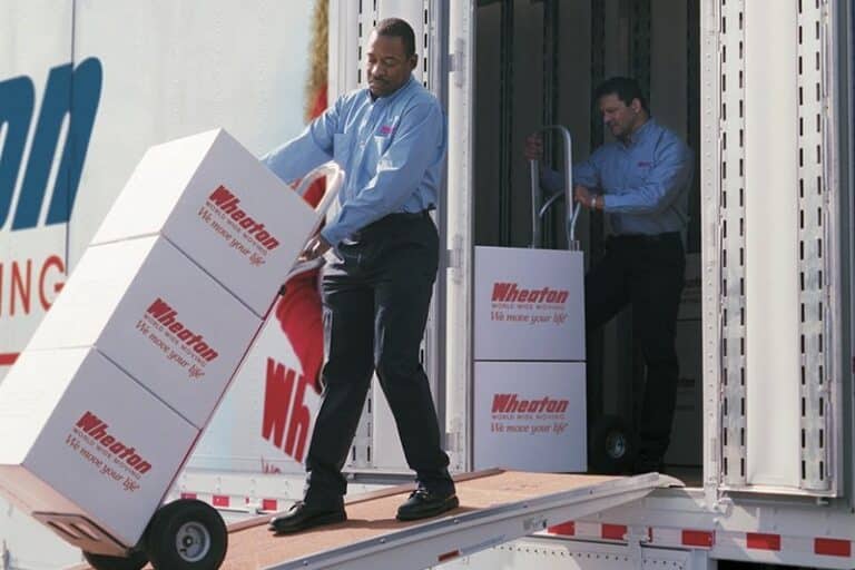 Movers loading boxes onto a Wheaton moving truck in Colorado Springs - 5 Star Moving & Storage Movers loading boxes onto a Wheaton moving truck in Colorado Springs
